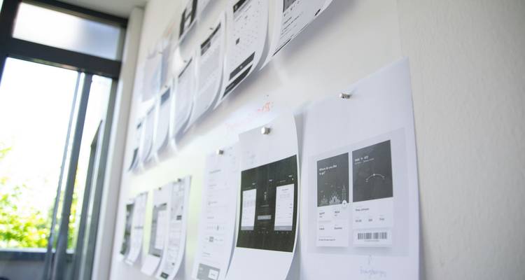 Design team collaborating on a Figma project with placeholder images visible on screen