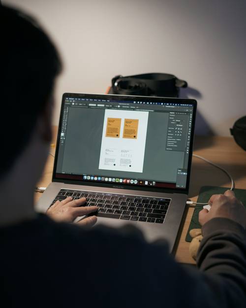 Designer reviewing a digital style guide for font selection in web design