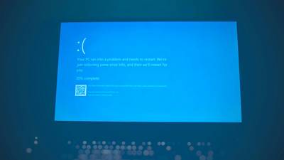 High-contrast blue and white placeholder image displayed on a desktop monitor