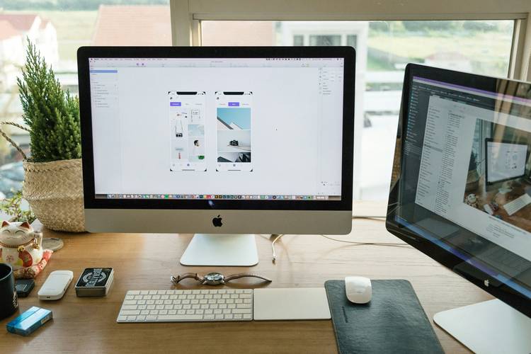 Web designer adjusting responsive image placeholders across devices