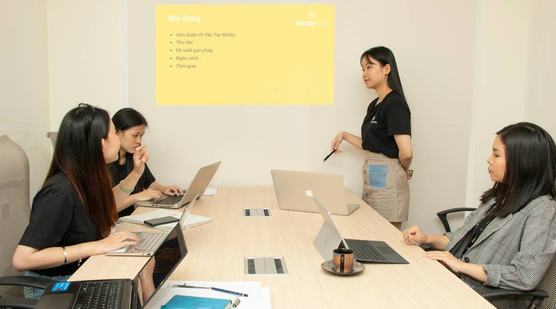 Business team reviewing presentation slide mockup with image placeholder